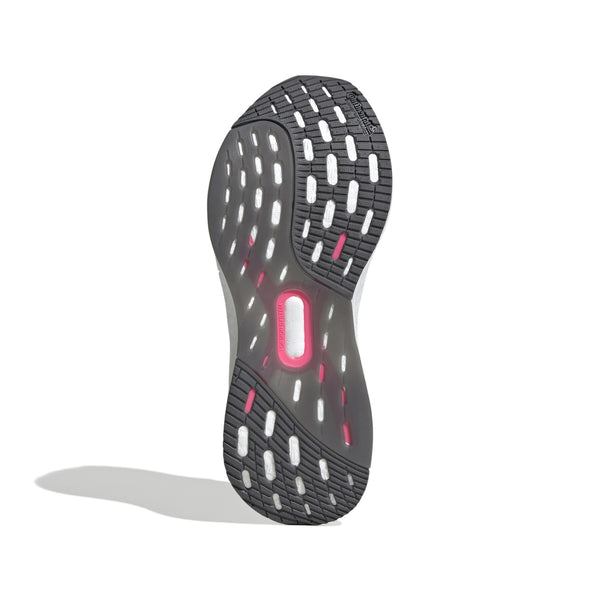Billedet viser sålen på Adidas Ultraboost 5X Dame i White/Purple Burst/Lucid Pink, en populær mængdetræningssko til løb, med en sort og hvid slidbane, lyserøde detaljer og et centralt lyserødt rektangel mod en hvid baggrund.