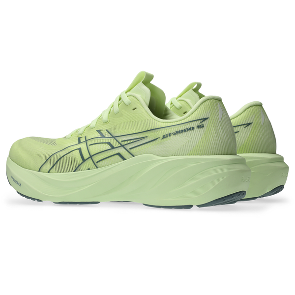 Et par ASICS GT-2000 15 stabilitetssko til mænd i farverne »illuminate yellow« og »foggy teal«, med tykke såler, mørke ydersåler, et markant ASICS-logo og modelnavnet trykt på siden.