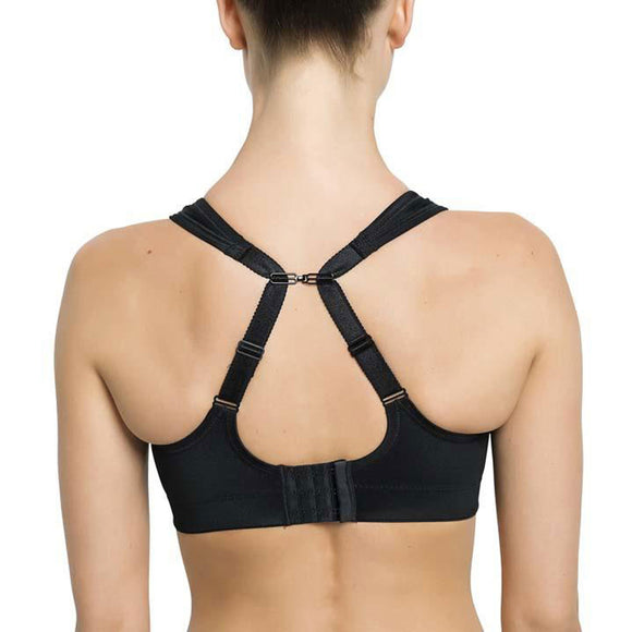 Her ses en person bagfra iført Purelime Compression Bra v1, Dame, Black. Denne sports-bh har justerbare stropper, en Y-formet racerback for maksimal støtte og en hægtelukning, der holder stropperne på plads midt bagpå.