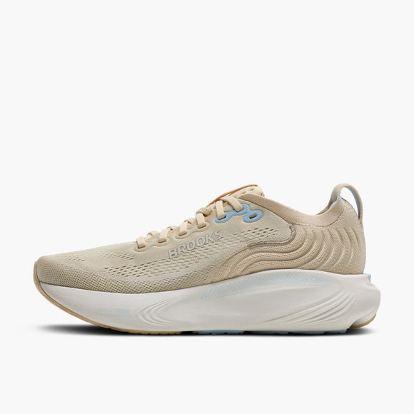 Brooks Adrenaline GTS 25 til damer i sand/coconut/skyway med beige mesh-overdel, lyseblå detaljer, BROOKS-logo på siden og en tyk, hvid bølget mellemsål-en stabil og stilfuld løbesko.