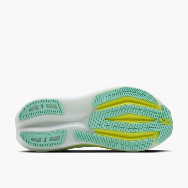 Billedet viser sålen på Brooks Glycerin Max 2, Dame (Yucca/Nightlife/White) med hvid bund, grøn slidbane og gule detaljer. "BROOKS" og en del af "CROSS" er synlige på hælen, hvilket afspejler maksimal komfort.