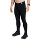 En person iført Motion+ Long Tights, Herre, Black fra Saysky, sammen med sorte sneakers og et sort armbåndsur, står på en hvid baggrund. Kun underkroppen er synlig; overkrop og hoved er ikke vist.