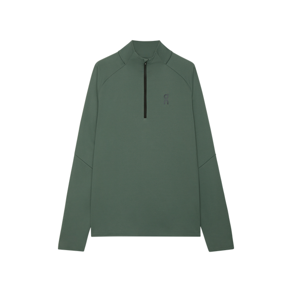 En olivenfarvet Climate Shirt til kvinder fra On med kvart lynlås foran og et lille mørkt logo på venstre bryst er lagt fladt mod en almindelig hvid baggrund.