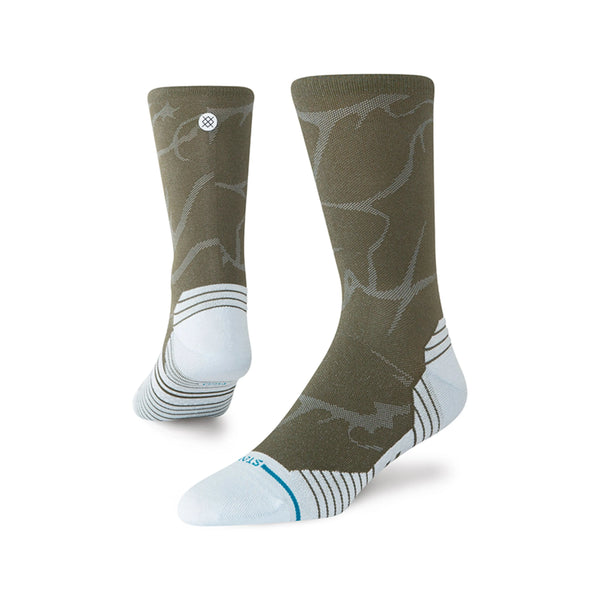 Stance 2000 UL Crew, Unisex, Blue strømper har et olivengrønt crew-cut med abstrakte mønstre, lyseblå hæle/tæer/knopper, et lille cirkulært logo øverst og stribede detaljer ved tæerne og anklerne for åndbar komfort.