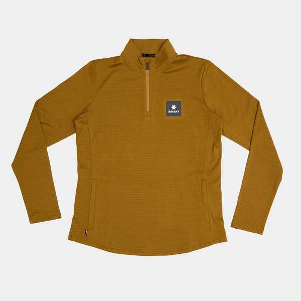 Saysky Blaze Half Zip Light Fleece til kvinder i camel er et let, teknisk mellemlag med logo, der er ideelt til lag på lag i skiftende vejr.