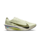 Et sidebillede af Nike Vaporfly Next% 4 Herre løbesko i Sea Glass/Sequoia-Ultralime-Phantom med en lysegul overdel, stor sort Swoosh, hvid ZoomX mellemsål, subtile grønne og blå hælaccenter og matchende lysegule snørebånd.