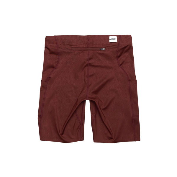 Saysky Combat+ Short Tights 9" til mænd i rød er vist bagfra med en lynlåslomme i linningen og et lille hvidt mærke. De er inspireret af tekniske løbetights og har et enkelt design med diskrete sømme og sidelommer.