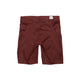 Saysky Combat+ Short Tights 9" til mænd i rød er vist bagfra med en lynlåslomme i linningen og et lille hvidt mærke. De er inspireret af tekniske løbetights og har et enkelt design med diskrete sømme og sidelommer.