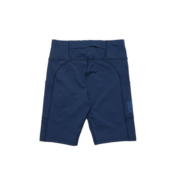 Saysky W Motion+ Short Tights 9" til kvinder, i blå, har sidelommer og et lille blåt mærke på venstre side - vist fladt på hvidt, ideelt til ethvert look med blå træningstøj.