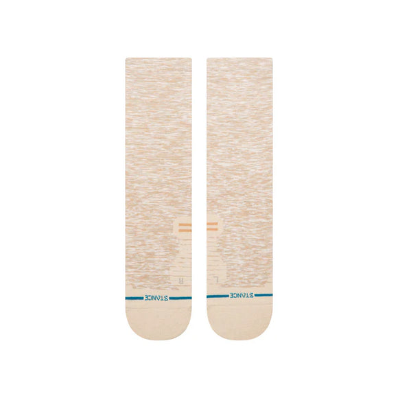 Et par Stance Marled Light Crew herresokker i havregryn ligger fladt side om side på en hvid baggrund med diskrete mønstre, blå striber nær tæerne og "STANCE" skrevet nær tåområdet.