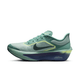 Et sidebillede af Nike Zoom Fly 6 Herre i Cannon/Seaweed-Light Silver-Cobalt Bliss med sort Swoosh, overdel i mesh, blå-gul mellemsål og polstret hæl i cushlon-skum.