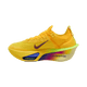 Nike Alphafly Next% 3 dame løbesko i Laser Orange/Indigo Burst-Citron Pulse har en tyk, flerfarvet ZoomX-sål, lilla swoosh og åndbar mesh-overdel, der vises mod en almindelig hvid baggrund.