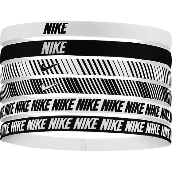 En pakke med seks Nike Flex Classic Headbands 6Pk Printed, Unisex, i White/Black/White - hver med unikke mønstre og logoer, perfekte som stilfulde og elastiske pandebånd til træning.