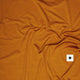 Saysky W Logo Pace T-Shirt til damer i orange har krøllet stof og et lille hvidt mærke med en sort stjerne - ideel som en svedtransporterende sportsbluse til dame løbetræning.