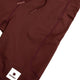 Nærbillede af Saysky Combat+ Short Tights 9" til mænd i rød med et diskret sekskantet mønster, sidelomme, snøre og et hvidt Saysky-mærke - perfekt til at sætte sammen med dine foretrukne løbetights til træning eller løb.