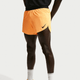 En mand iført Nike AeroSwift 4In Brief-Lined Running Shorts i Laser Orange/Black, designet til komfort og performance, sammen med sokker.