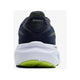 Et kig bagud på Brooks Ghost 17 herre i Peacoat/Lime/Blue viser "BROOKS" på hælen, en tyk hvid sål og en lysegrøn ydersål. Skoen er designet til komfort og stabilitet og står på en almindelig hvid baggrund.