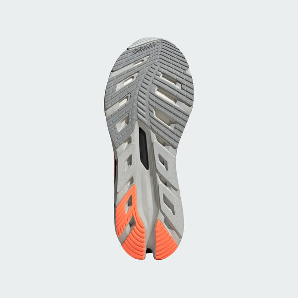 Billedet viser sålen på en Adidas Adistar Byd Dame løbesko i Clgrey/Beaora/Halsil, med grå og orange slidbane, flexriller, en sort midtersektion og Continental-logoet nær tåen for maksimal komfort.