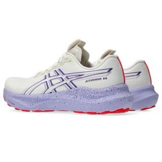 Asics GT-2000 14 Tokyo Dame i Cream/Edo Purple har hvid atletisk overdel med lilla accenter, en spættet lyslilla FF BLAST PLUS-mellemsål, røde ydersåler og viser ASICS-logoet og GT-2000 14-branding for stabilitet.