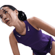 En kvinde i Nike AeroSwift Running Singlet, Dame, Court Purple/White læner sig frem og ser træt og svedig ud med hvide Nike-logoer synlige på en hvid baggrund.