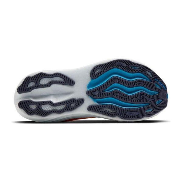 Billedet viser sålen på Brooks Glycerin Max, Herre, i Blazing Orange/Blue/White med en hvid base og blå og sorte bølgelignende gummimønstre for overlegen komfort, greb og fleksibilitet.