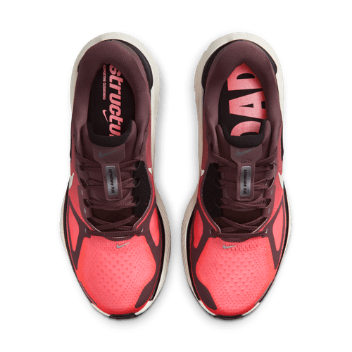 Topbillede af Nike Structure Plus Dame løbesko i Tattoo/Silver-Hot Lava-Black med "structu" og "DAP" på indlægssålerne. Disse sko har overdel i mesh, sorte detaljer og er ideelle til overpronation.