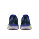 Et par Nike Zoom Fly 6 løbesko herre i Obsidian/White-Persian Violet-Volt vises bagfra på en hvid baggrund med en mørkeblå overdel, lilla hæl og lysegrønne detaljer. "NIKE" er synligt på hver hæl.