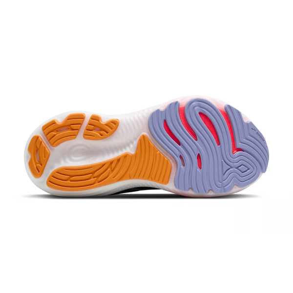 Billedet viser ydersålen på Brooks Glycerin GTS 22 Dame i Black/Blue Heron/Orange, en støtte løbesko til damer med et bølget mønster og gummiprofiler i orange, lavendel og pink på en overvejende hvid sål.