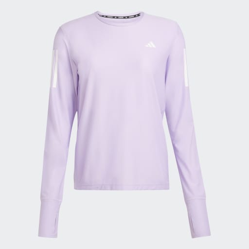 Adidas Otr B Ls træningstrøje til damer i farven Powplu har en rund halsudskæring, hvidt logo, AEROREADY-teknologi og hvide rektangulære detaljer på ærmerne, der giver et sporty look.