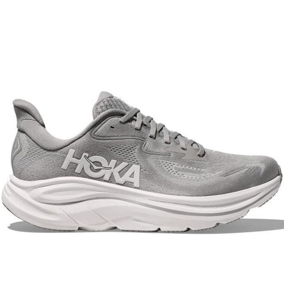 Hoka Clifton 10, Herre i Stellar Grey / Stardust har en tyk hvid sål, overdel i mesh og snørelukning til neutral pronation, vist fra siden på en hvid baggrund.