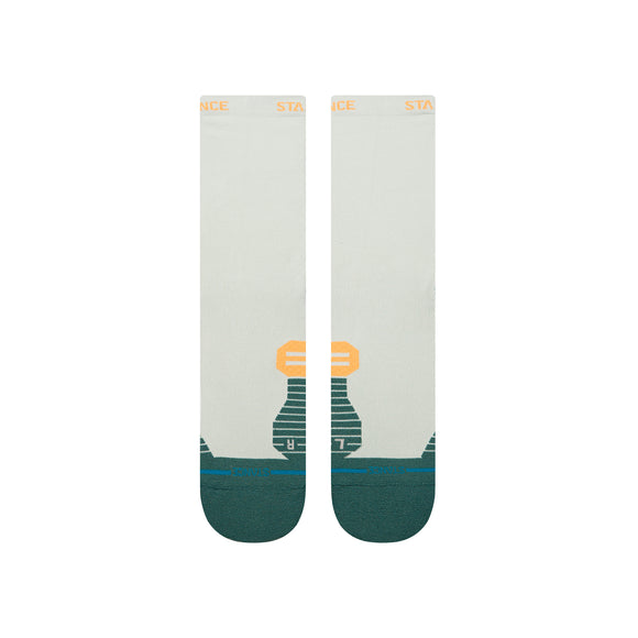 Stance Doubled Up Light Crew strømper i blågrøn er unisex performance strømper med et geometrisk orange og grønt design, mørkegrønne tæer og hæl og "STANCE" i orange på båndet.