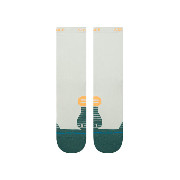 Stance Doubled Up Light Crew strømper i blågrøn er unisex performance strømper med et geometrisk orange og grønt design, mørkegrønne tæer og hæl og "STANCE" i orange på båndet.