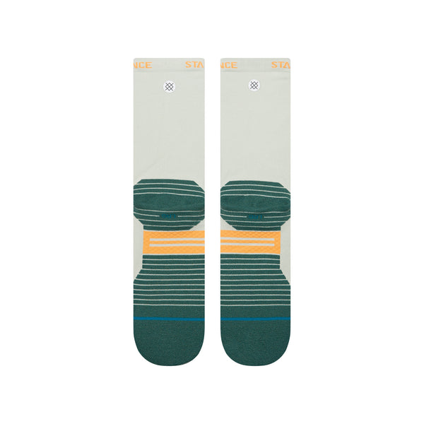 Stance Doubled Up Light Crew unisex-strømper i blågrøn har et geometrisk design med grønne og gule detaljer på en lys beige bund samt mørkegrønne tæer og hæle, der giver en stilfuld performance.