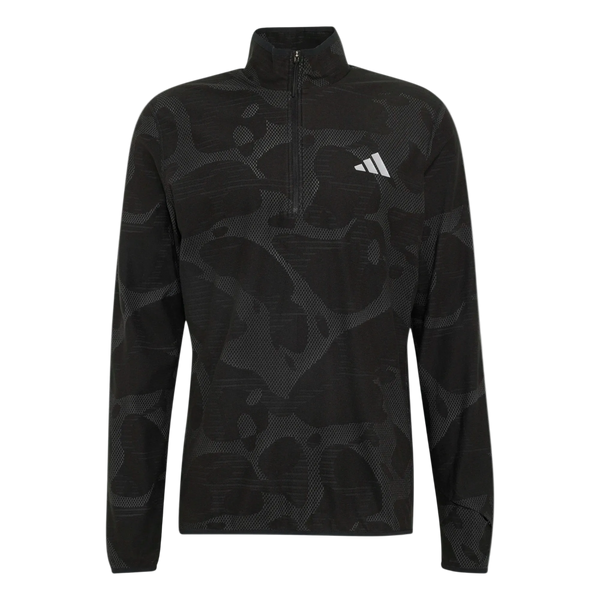 Adidas Adi365 Running Half Zip Long Sleeve til mænd i farven Black/Grefiv, der præsenteres på en ensfarvet hvid baggrund, har lange ærmer, et diskret abstrakt mønster, en krave med kvartlængde lynlås og et skarpt hvidt Adidas-logo på venstre bryst. Denne sportstrøje er mesterligt udformet til at kombinere stil og ydeevne og er designet til at give enestående komfort under dine løbeture.