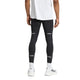 En person ses bagfra iført en hvid skjorte, Adidas Adi365 Tights M for men i sort med refleksstriber, hvide sokker og hvide sneakers mod en almindelig hvid baggrund.