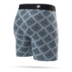 Stance Alhambra Wholester, Herre, Blue boxershorts er designet med fokus på komfort og har en tætsiddende pasform med blå baggrund og et geometrisk mønster over hele overfladen i mørkegrå og gul. De er designet med en sort linning, der er prydet med et lille cirkulært logo i midten, hvilket gør disse boxershorts til et uundværligt stykke herreundertøj fra Stance.