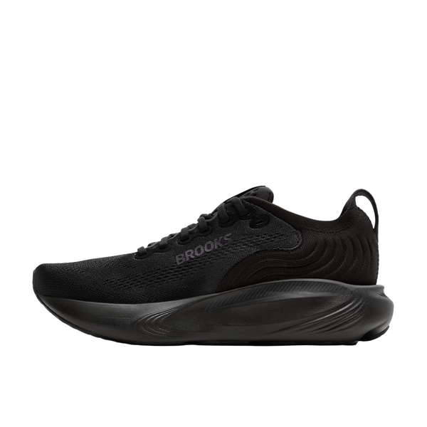 Brooks Adrenaline GTS 25 til kvinder i Black/Black/Ebony har en overdel i mesh, snørelukning og en tyk struktureret sål, der giver stabilitet. Brooks-logoet vises på siden. Skoen er vist fra siden mod en hvid baggrund.