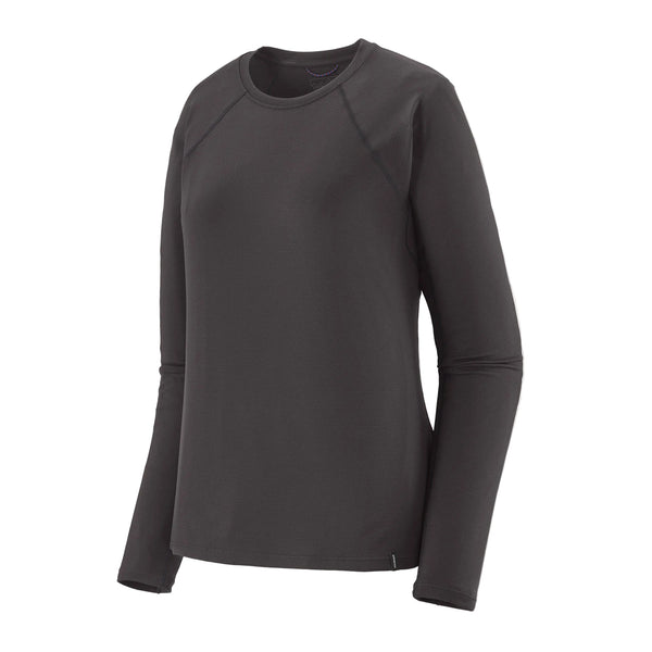 En Patagonia Cap MW Crew, Dame, i farven Ink Black – en ensfarvet langærmet T-shirt med rund hals, der er ideel som inderlag til løb – er afbilledet på en hvid baggrund. T-shirten, der er vist forfra i en let vinkel, har ingen synlige logoer eller mønstre.