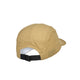 Saysky Combat Shield-kasketten, unisex i beige, er her afbilledet set bagfra, hvilket fremhæver de små ventilationshuller på sidepanelerne, det funktionsmateriale med gitterstruktur samt en justerbar sort rem med spænde, der sikrer en tilpasset pasform. Det delvist synlige inderfor bidrager til det detaljerede design.