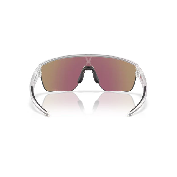 Et par Oakley Corridor SQ-solbriller, Matte Clear/Prizm Sapphire, med en enkelt wraparound-linse med blå reflekterende farvetone og gennemsigtigt stel, der giver UV-beskyttelse. Vist forfra mod en hvid baggrund.