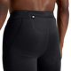 Et nærbillede af en person iført On Performance Tights Short til kvinder i sort, der fremhæver den bageste linning med en lille lynlåslomme. Den skjorteløse model står på en almindelig hvid baggrund.