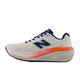 Et sidebillede af New Balance FreshFoam 860 v15 løbesko dame i Sea Salt/Blue Oyster med mørkeblåt N-logo, blåt snørebånd og en kraftig hvid sål med orange detalje markeret STABILITY PLANE.