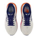 Et par New Balance FreshFoam 860 v15 dame løbesko i Sea Salt/Blue Oyster, vist fra oven med hvid mesh-overdel, blå og lilla detaljer og 860-branding - perfekt stabilitetssko til kvinder.