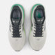 Et par New Balance FreshFoam 860 v15 løbesko herre i Reflection/Graphite, set ovenfra, med sorte snørebånd, grønne og sorte detaljer, overdel i mesh, synlig branding på pløs/sål, designet til stabilitet.