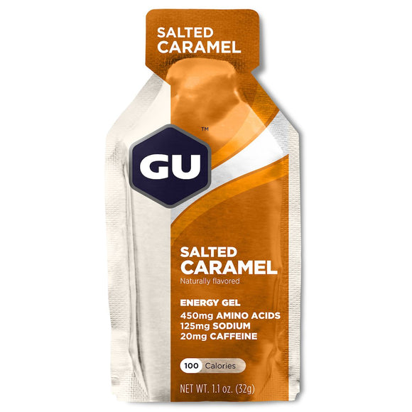 GU Energy Gel, Salted Caramel fra GU Energy kommer i en enkelt portionspose på 32 g (1,1 oz) med hvid og orange emballage med næringsoplysninger og GU-logoet i toppen.