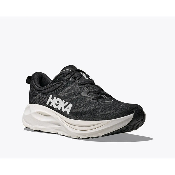 Hoka Gaviota 6 Herre i sort/hvid har en tyk hvid sål og et fedt HOKA-mærke på siden, der vises på en almindelig hvid baggrund.