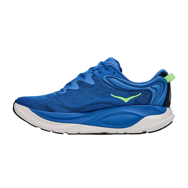 Hoka Gaviota 6, Herre, i farvekombinationen Virtual Blue / Varsity Navy byder på maksimal komfort med en blå overdel, hvid og sort sål, en lysegrøn hælflap og et grønt logo på siden, vist i venstre profil mod en hvid baggrund.