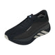 Vi præsenterer Adidas Hyperboost Edge til kvinder i farvekombinationen Chacoa/Ntgrey/Alumin x Hermanos Koumori: en sort løbesko til landevej, designet med en tyk, buet sål, en overdel i åndbart mesh og iøjnefaldende hvide detaljer på siden og tåen. Denne komfortfokuserede løbesko har synligt adidas-tekstlogo nær snørebåndene og et karakteristisk logo på tungen, hvilket giver løbere både støtte og stil.
