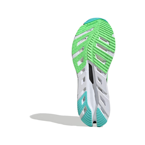 Billedet viser sålen på Adidas Adistar Byd, Dame (Halmin/Limbur/Flaaqu) med grønne, hvide og blågrønne sektioner, en mønstret slidbane og et Continental-logo øverst på en hvid baggrund.