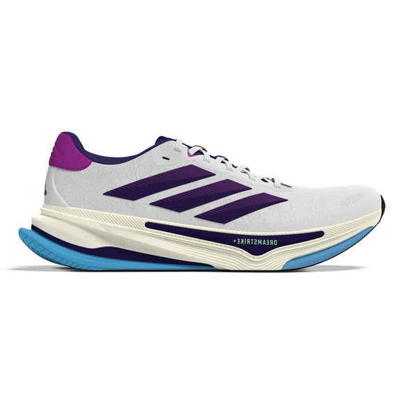 Adidas Supernova Prima 2 Dame løbesko i Cwhite/Cpurpl/Seblbu er hvid med lilla og navy accenter, tre diagonale striber, en tyk cremefarvet sål med blå slidbane for stabilitet og DREAMSTRIKE-tekst nær sålen.